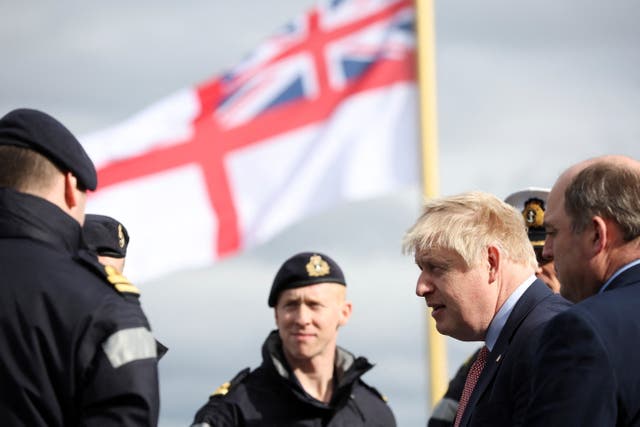 Boris Johnson speak with members of the ship’s company onboard HMS Dauntless (Phil Noble/PA)