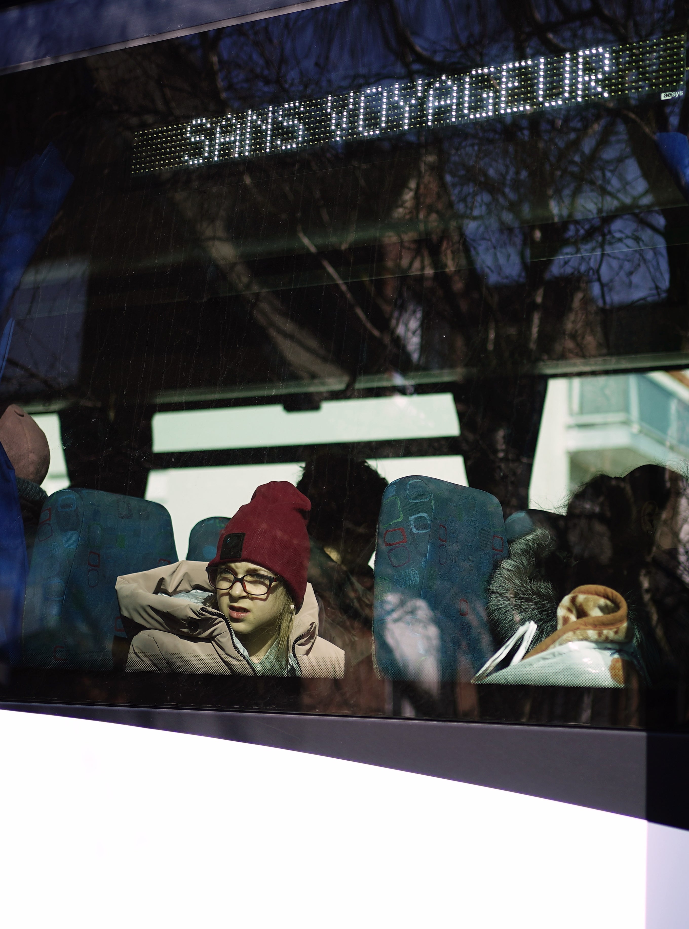 Ukrainian refugees sit on board a bus before it departs Calais (Aaron Chown/PA)
