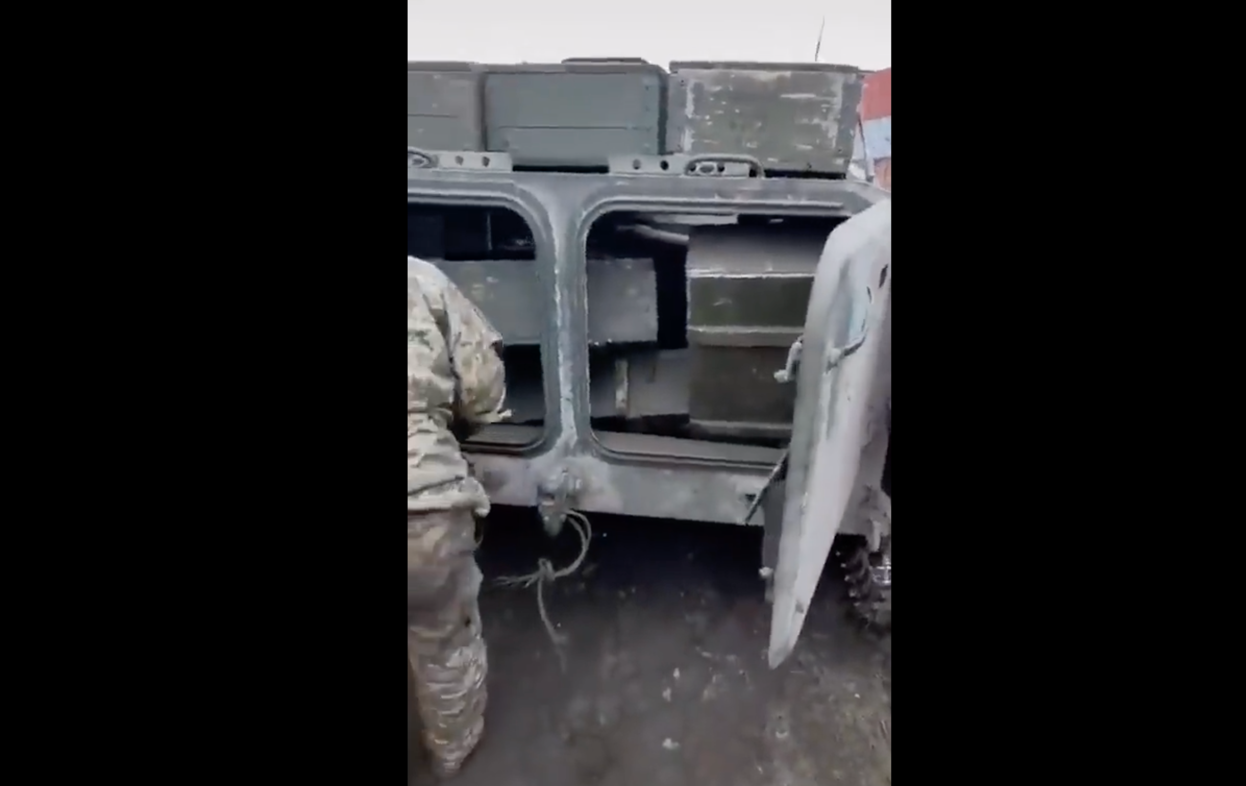 Boxes of ammunition can be seen stacked within the vehicle
