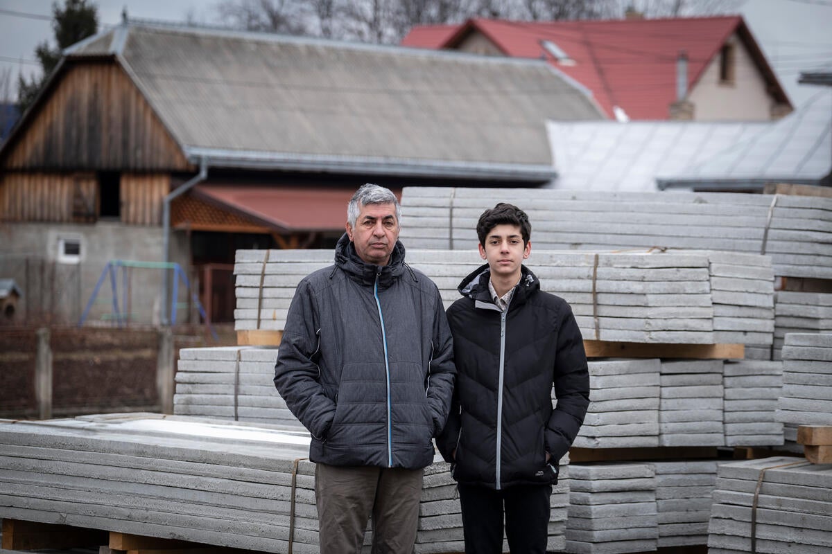 Mohammad is pictured with his son Samad in Romania (Save the Children/PA)