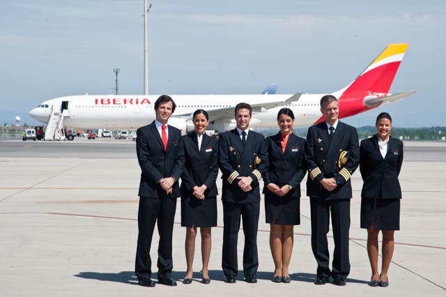 <p>Iberia’s current uniform, with women in the lower three-centimetre heel</p>