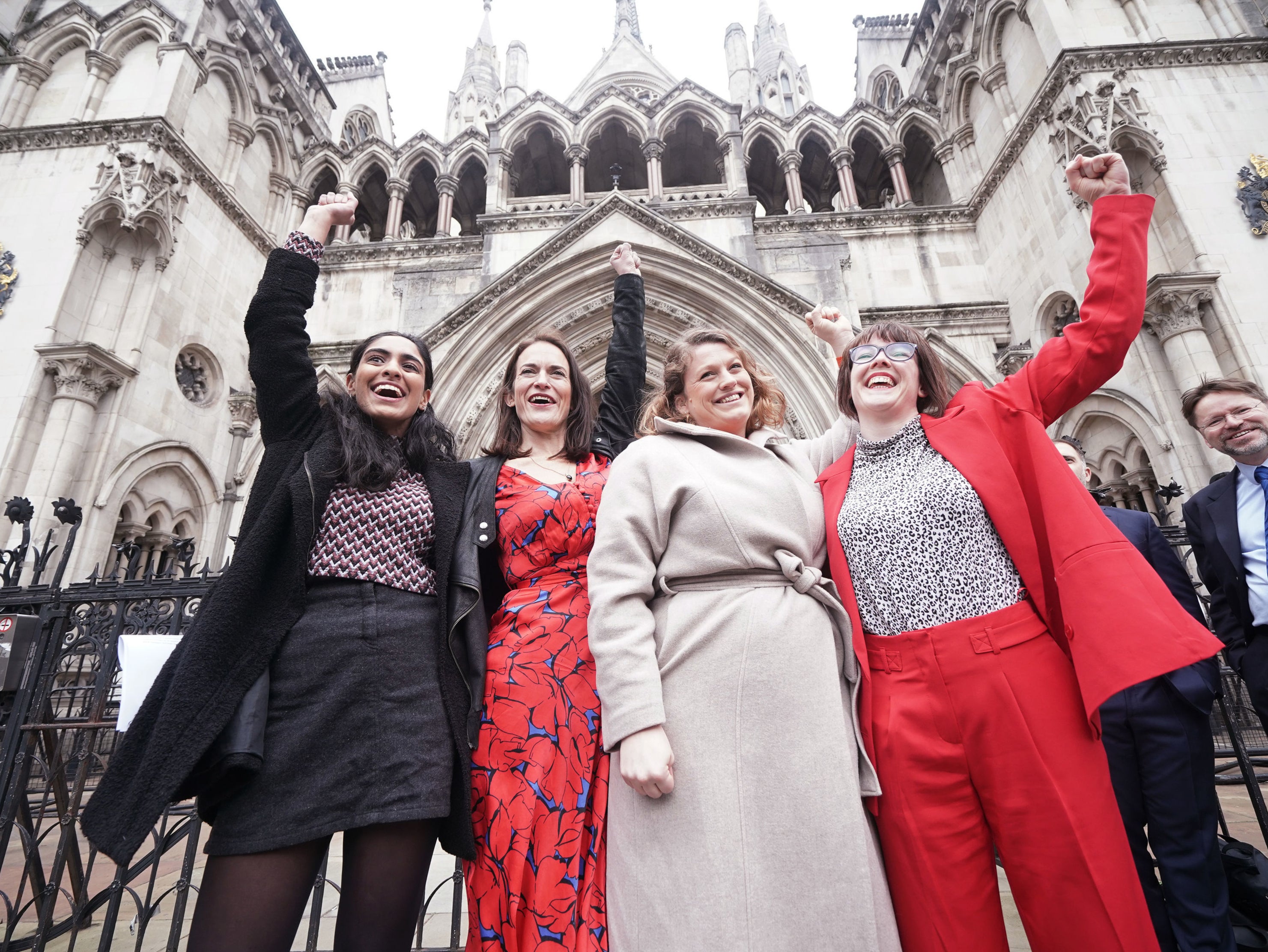 Reclaim These Streets founders (left to right) Henna Shah, Jamie Klingler, Anna Birley and Jessica Leigh celebrate outside the Royal Courts of Justice, London, after winning their legal challenge against the Metropolitan Police