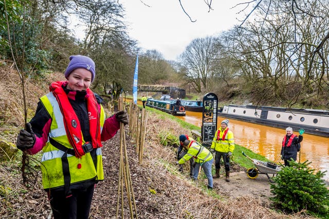 Students from Newfriars College help plant trees at Harecastle Tunnel on the Trent and Mersey Canal (Canal and River Trust/PA)