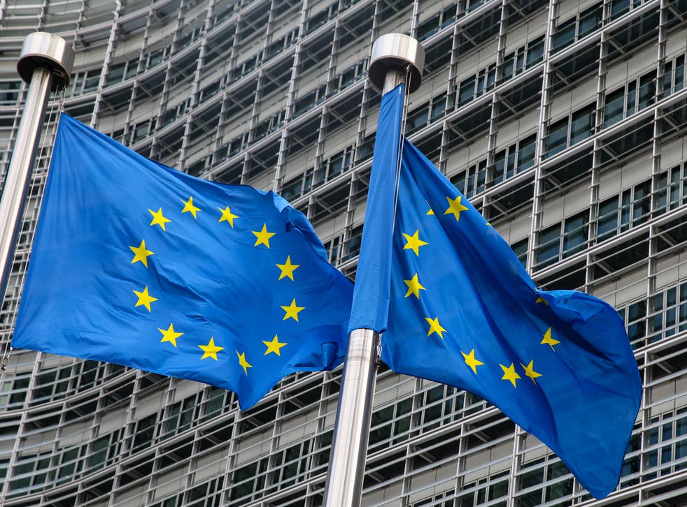 <p>European Union flags fly outside the headquarters of the European Commission in Brussels </p>
