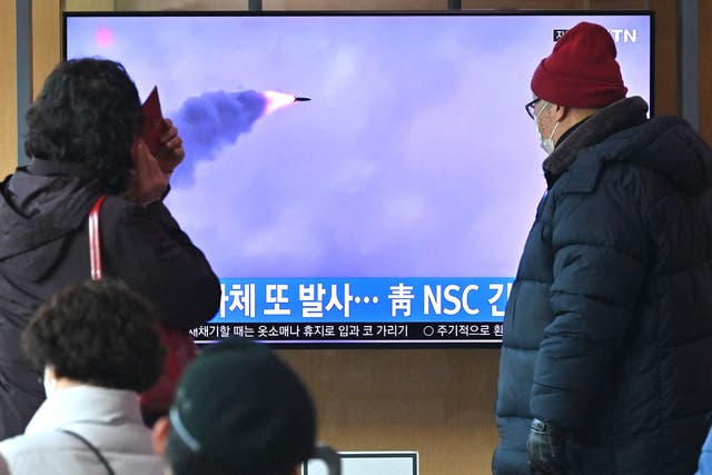 <p>South Koreans watch footage of a 27 February missile test by North Korea</p>