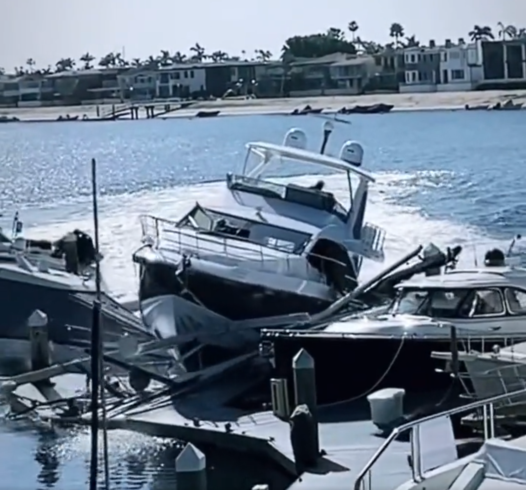 A stolen yacht smashed into several boats and a dock in Newport Beach Harbor, California