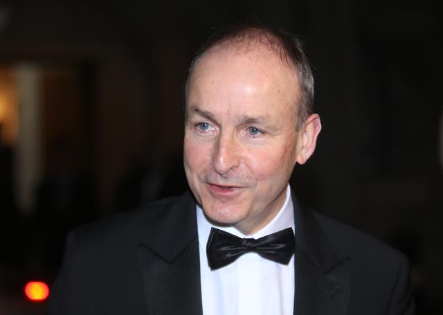 Taoiseach Micheal Martin speaking to the media as he arrives for a formal dinner with the Lord Mayor of the City of London Vincent Keaveny at Mansion House in London (James Manning/PA)