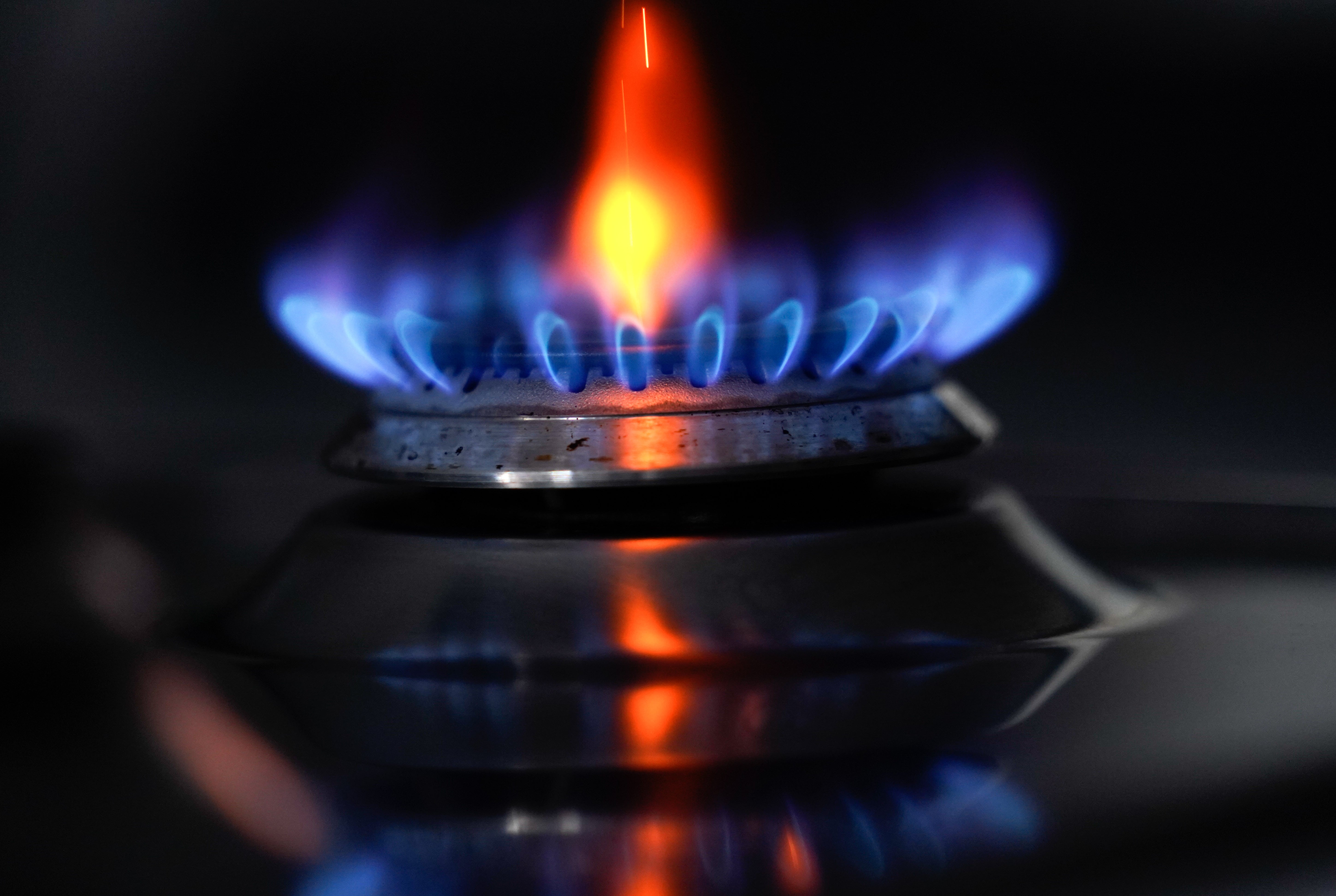 A gas hob burning on a stove (Andrew Matthews/PA)