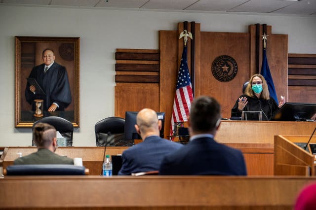 <p>Judge Amy Clark Meachum addresses the court in Austin, Texas, on 11 March</p>