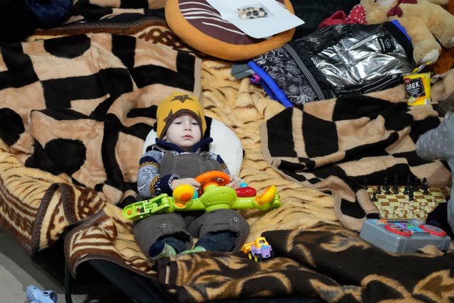 A boy holds a toy as he rests in a centre for Ukrainian refugees in Warsaw, Poland (Czarek Sokolowski/AP)