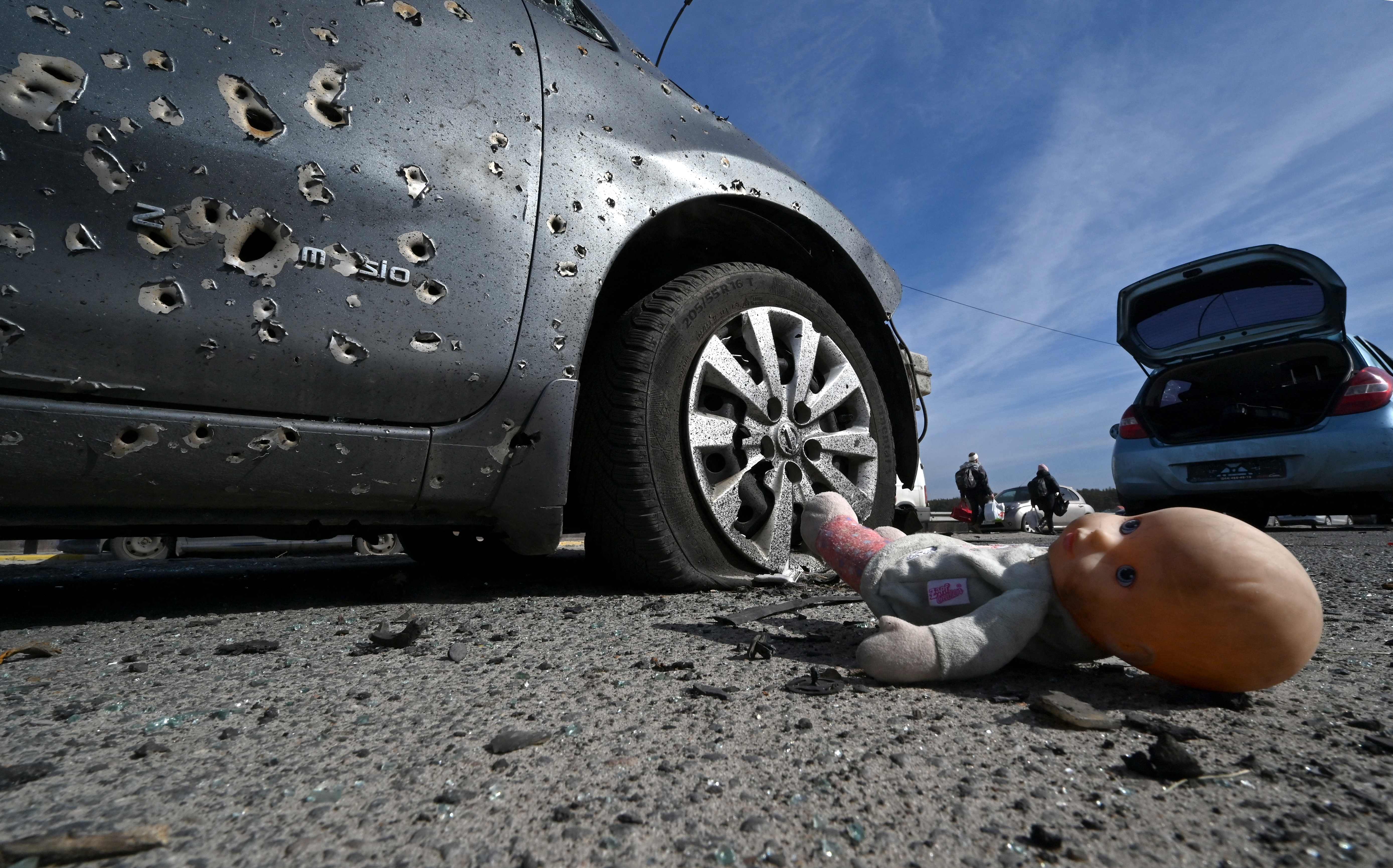 An abandoned doll next to a car riddled with bullets in Irpin, north of Kyiv. There are fears in Moldova that the war could spread from the neighbouring country