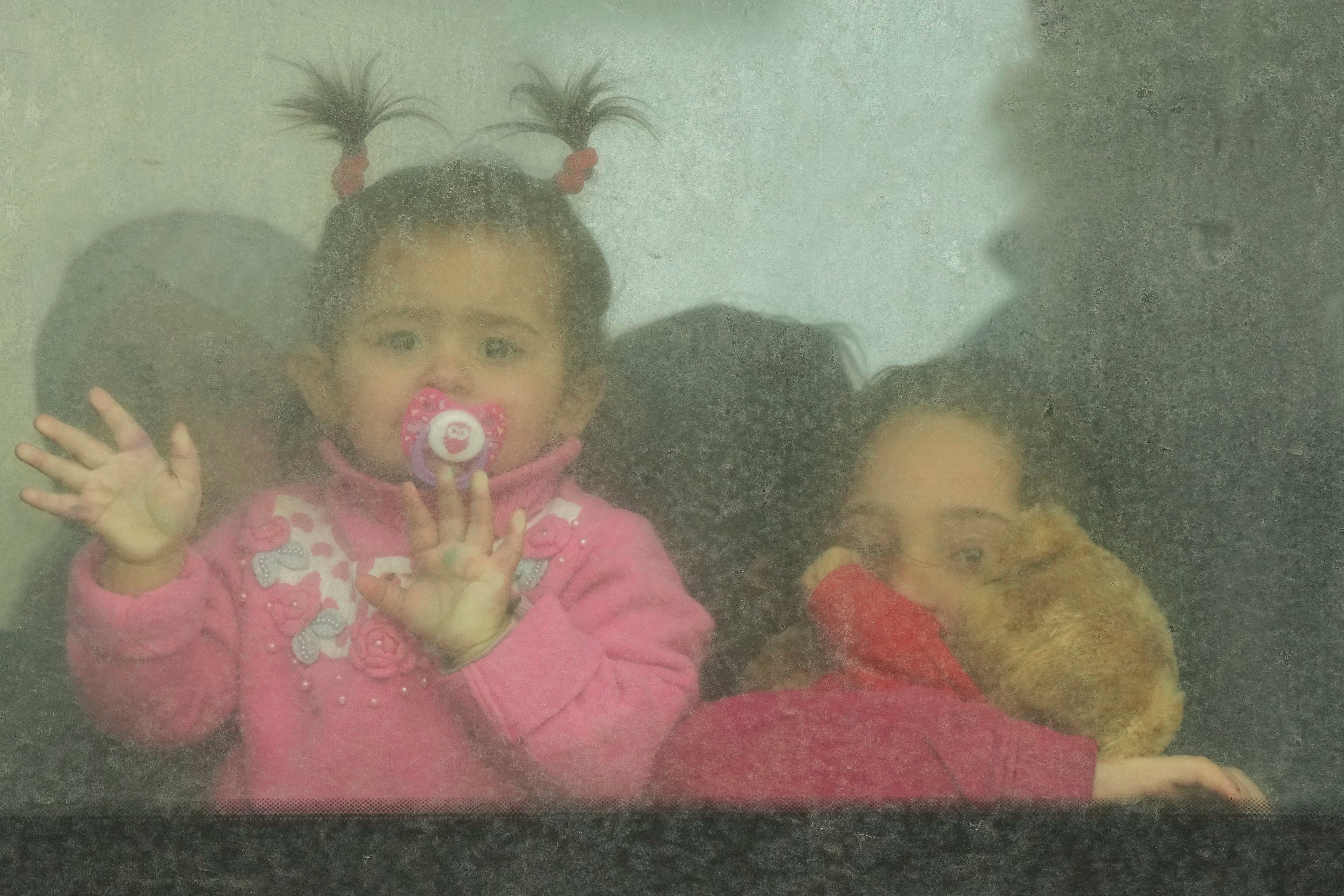 Refugee children on a bus heading to Romania after fleeing the war in Ukraine, at the border crossing in Palanca, Moldova