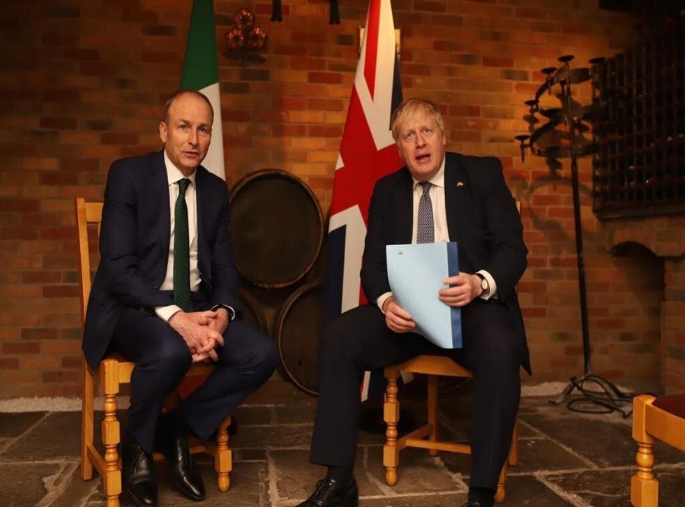 Taoiseach Micheal Martin speaking to Prime Minister Boris Johnson at Twickenham Stadium during his visit to the UK (Irish Government/PA)
