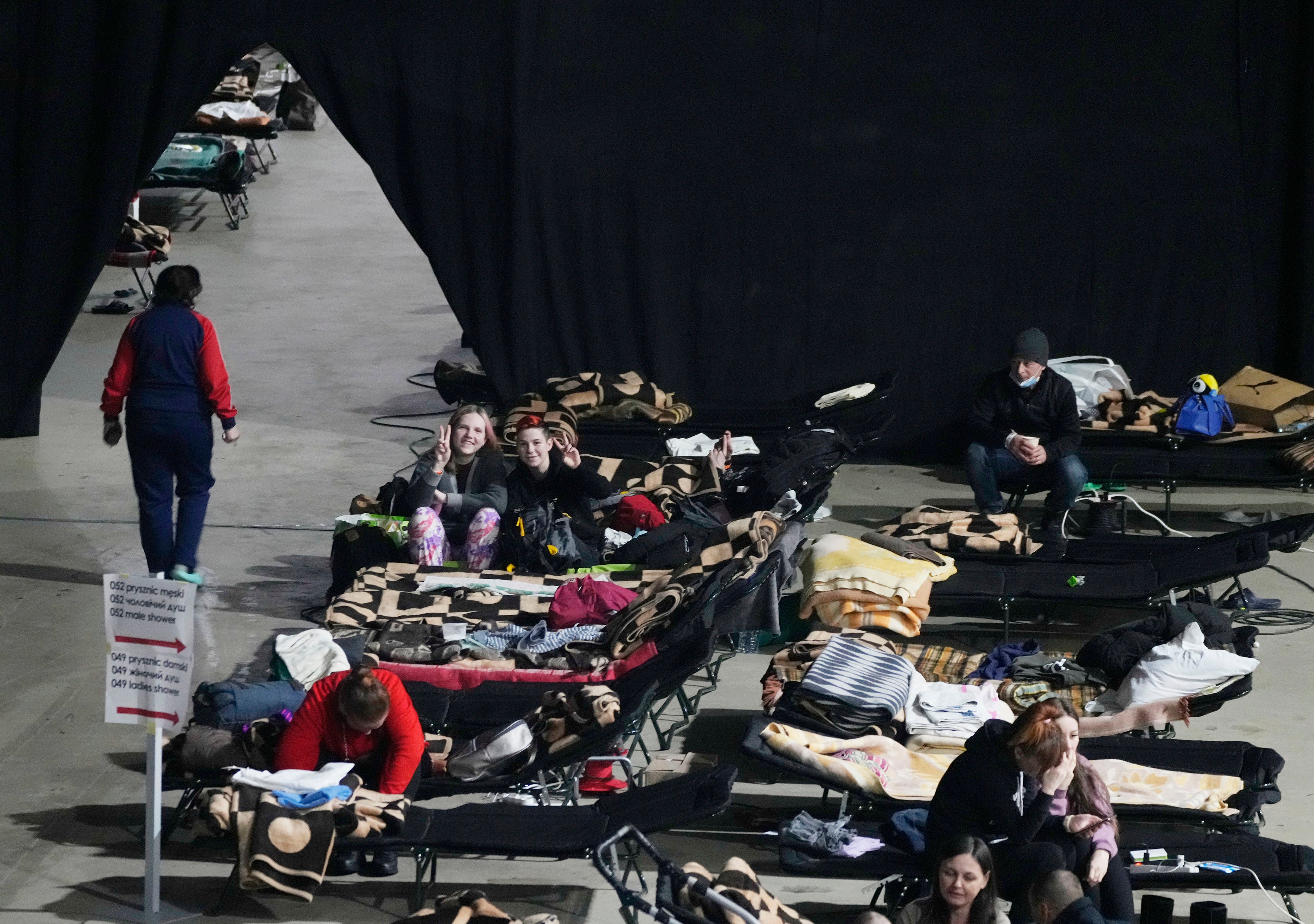 Refugees from the war in Ukraine seek shelter in Warsaw (Czarek Sokolowski/AP)