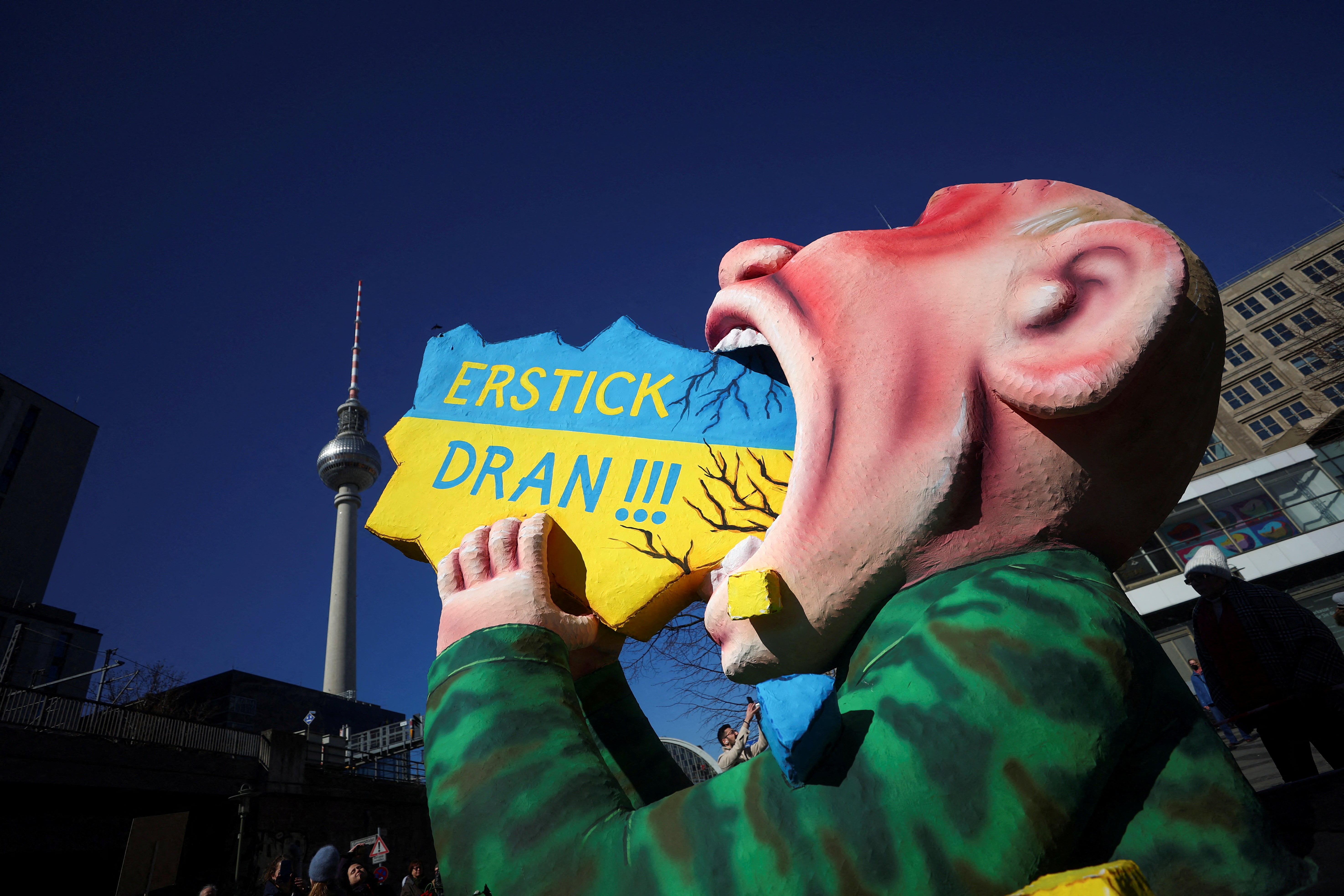 A carnival float depicting Vladimir Putin by Dusseldorf artist Jacques Tilly is pulled through Berlin during an anti-war demonstration