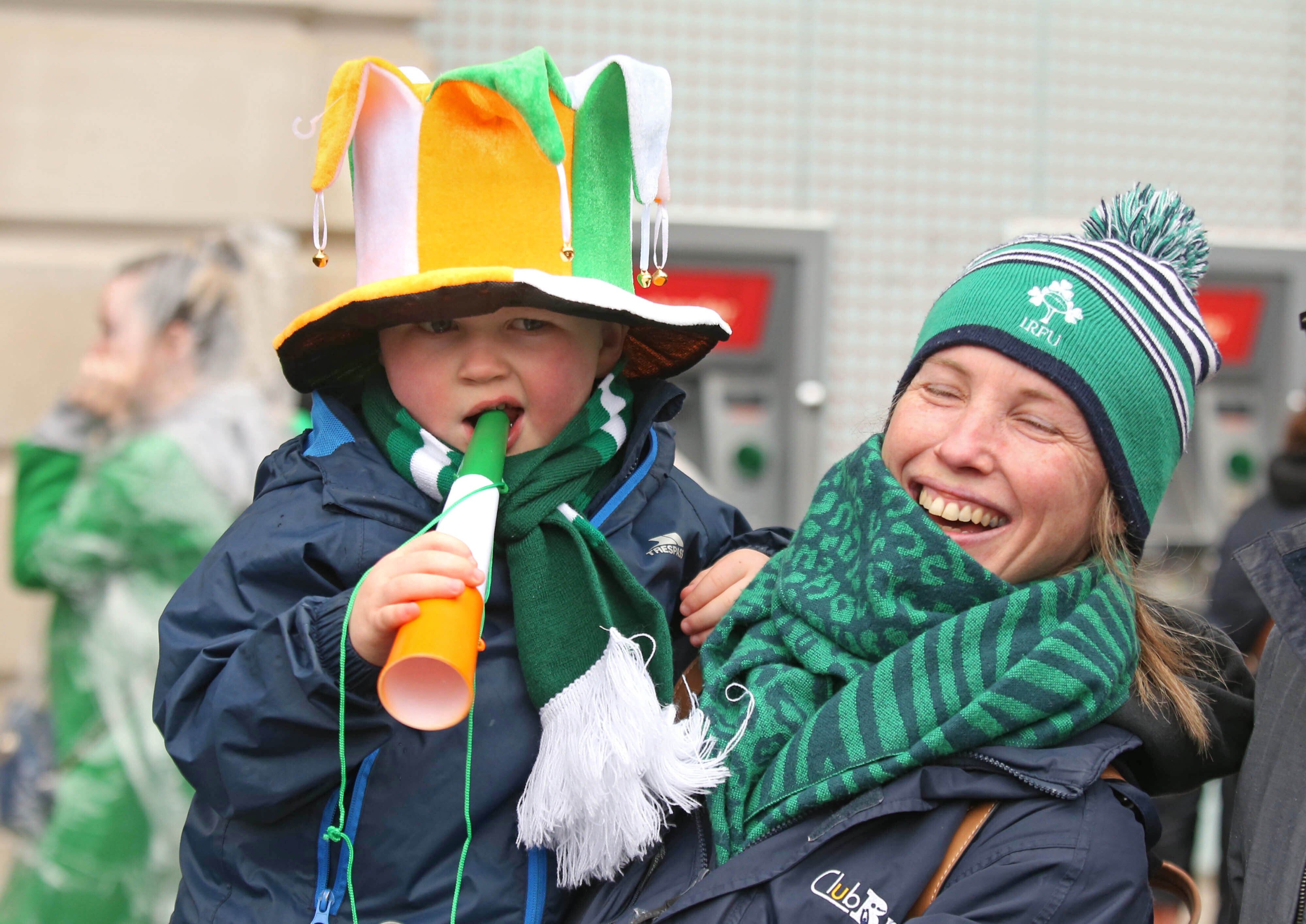Archie, four, and his mother watch the St Patrick’s Day parade (James Manning/PA)