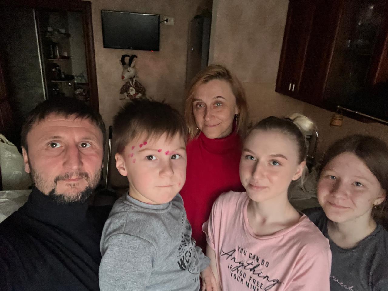 Artem Ivanov (left) and his wife Olena Ivanova (middle) and their three children. (Artem Ivanov/PA)