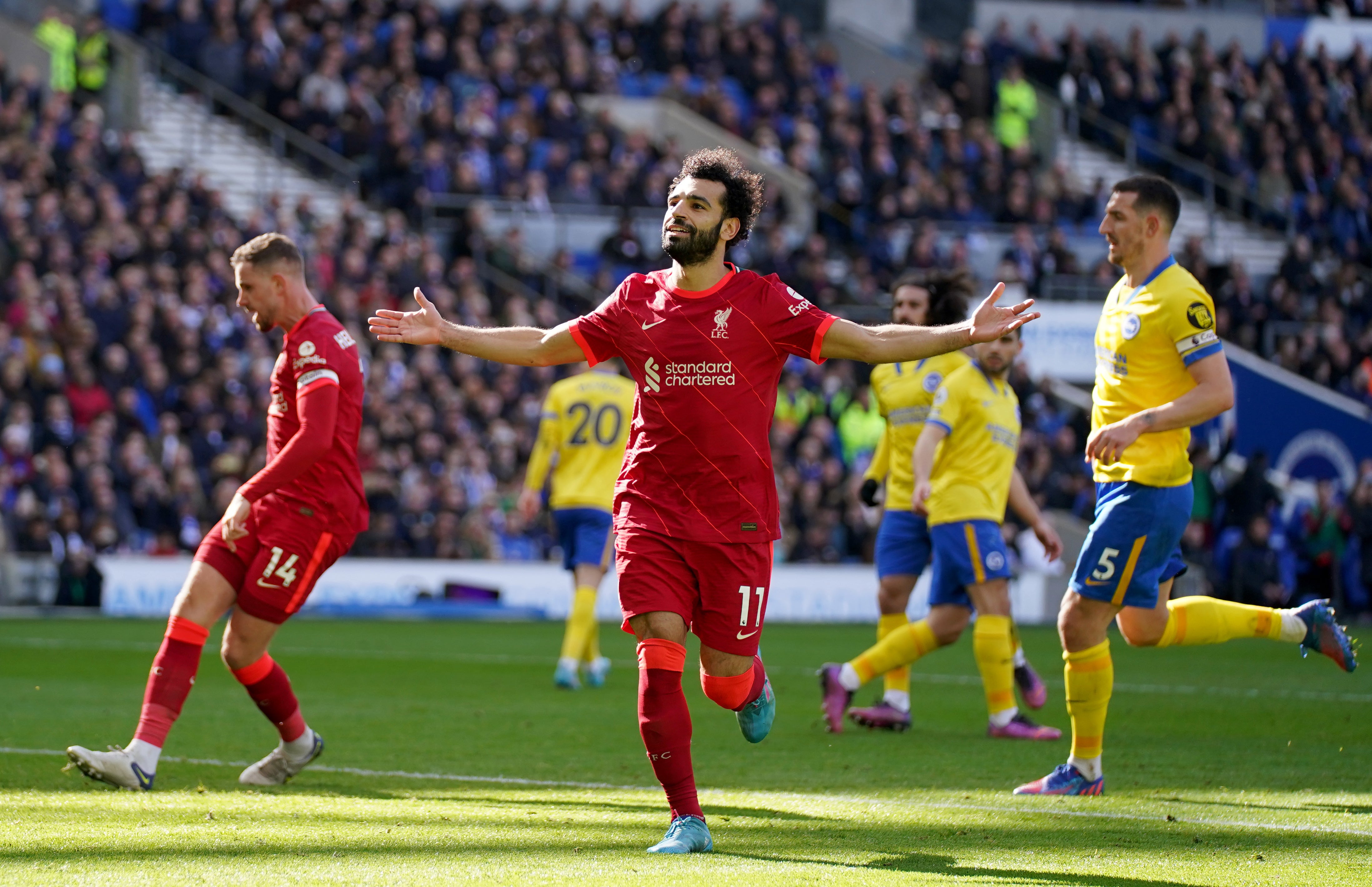 Liverpool’s Mohamed Salah celebrates scoring his side’s second goal against Brighton (Nick Potts/PA)