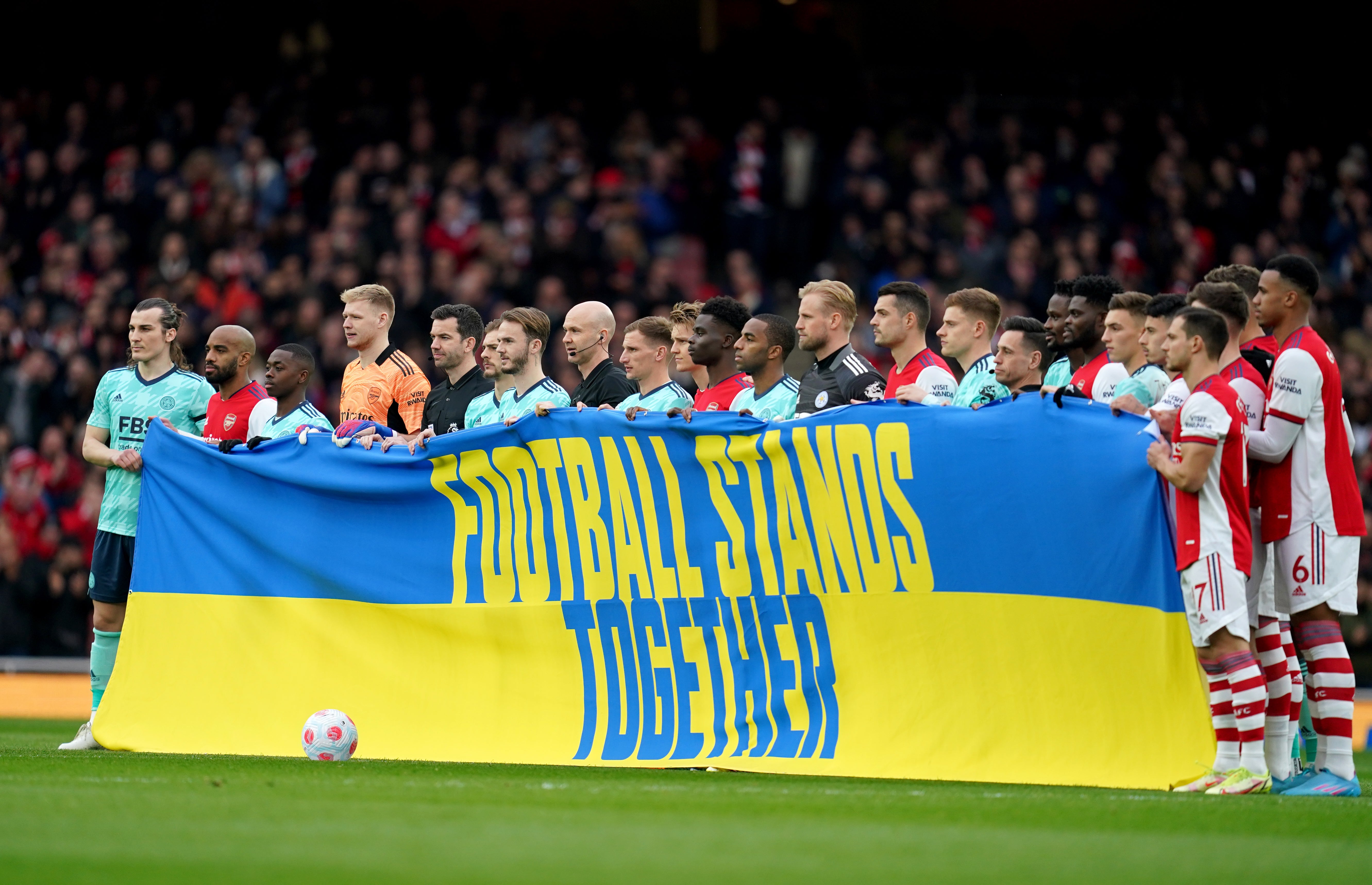 Football continued to stand for the people of Ukraine with Arsenal and Leicester players showing their support before their Premier League game on Sunday (Nick Potts/PA)