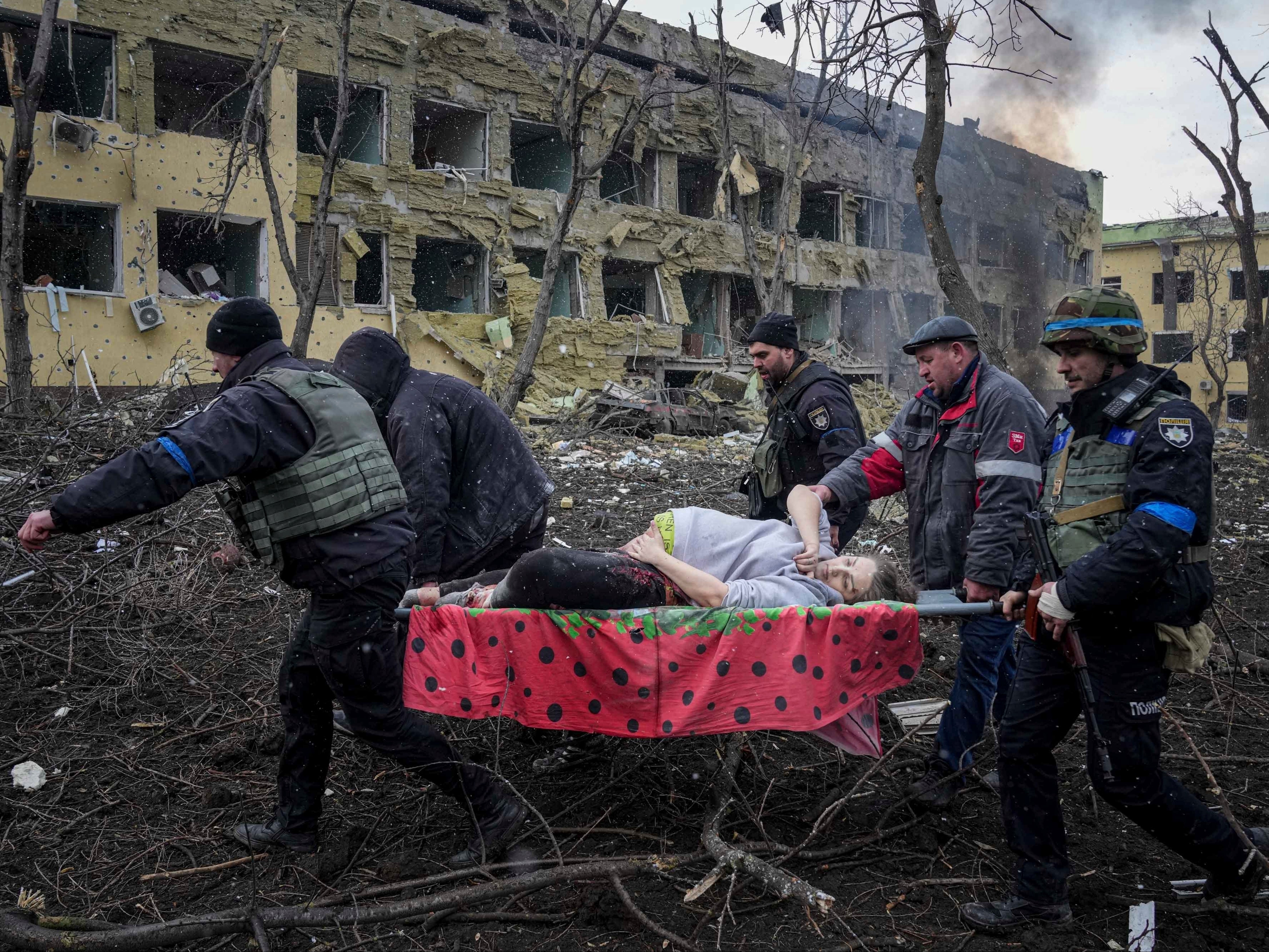 The pregnant woman was carried away on a stretcher after being injured in the Mariupol bombing