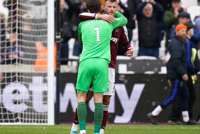 <p>West Ham’s Andriy Yarmolenko is embraced by goalkeeper Lukasz Fabianski (John Walton/PA)</p>