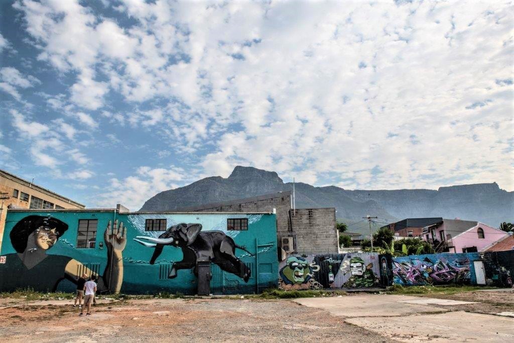 Guide Juma Mkwela with street art in Woodstock, Cape Town