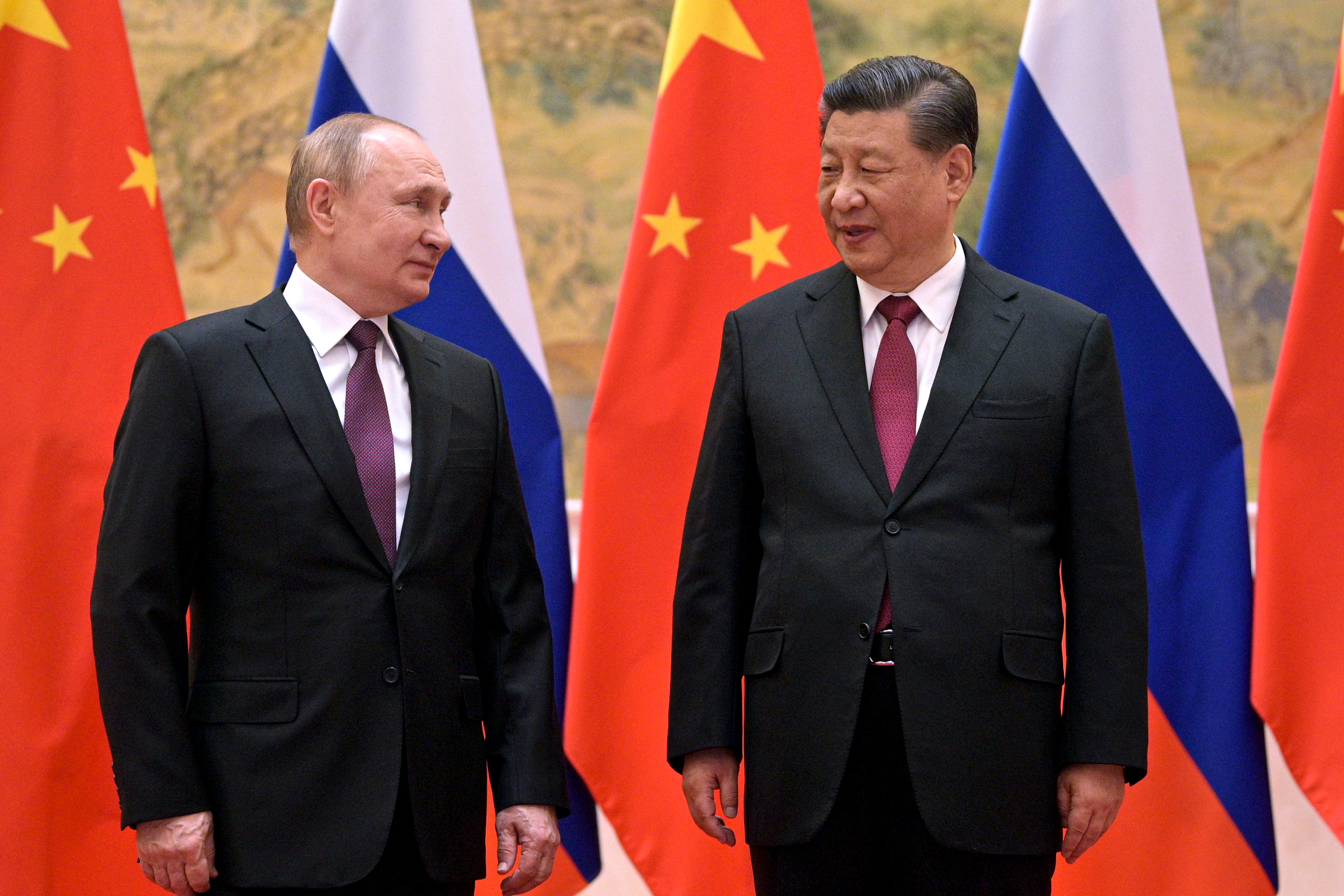 Russian president Vladimir Putin (L) meets his Chinese counterpart Xi Jinping (R) in Beijing on 4 February, 202