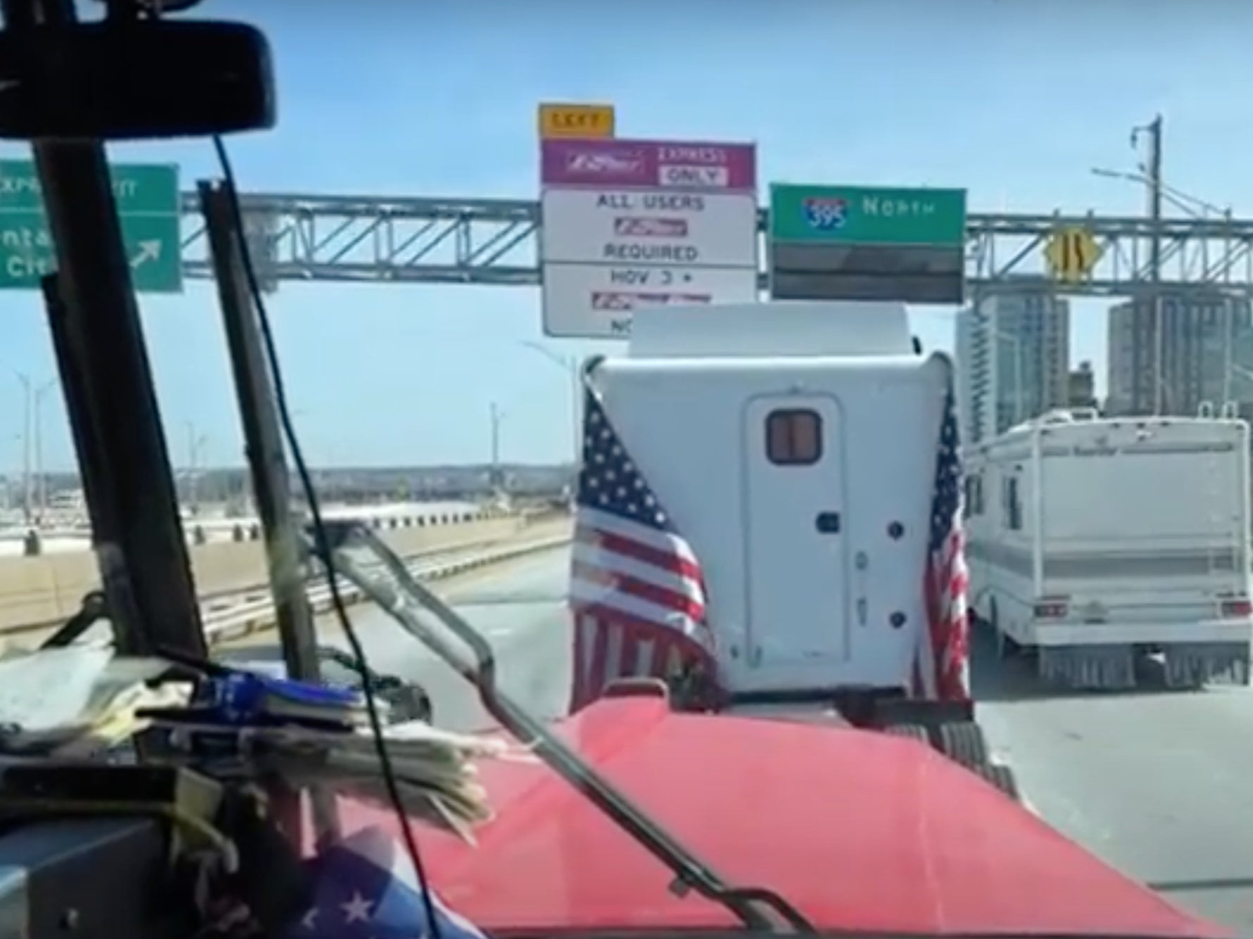 <p>An image from the cabin of one of the drivers participating in the ‘People’s Convoy’ as the trucks sit in traffic on I-395 heading into Washington DC</p>