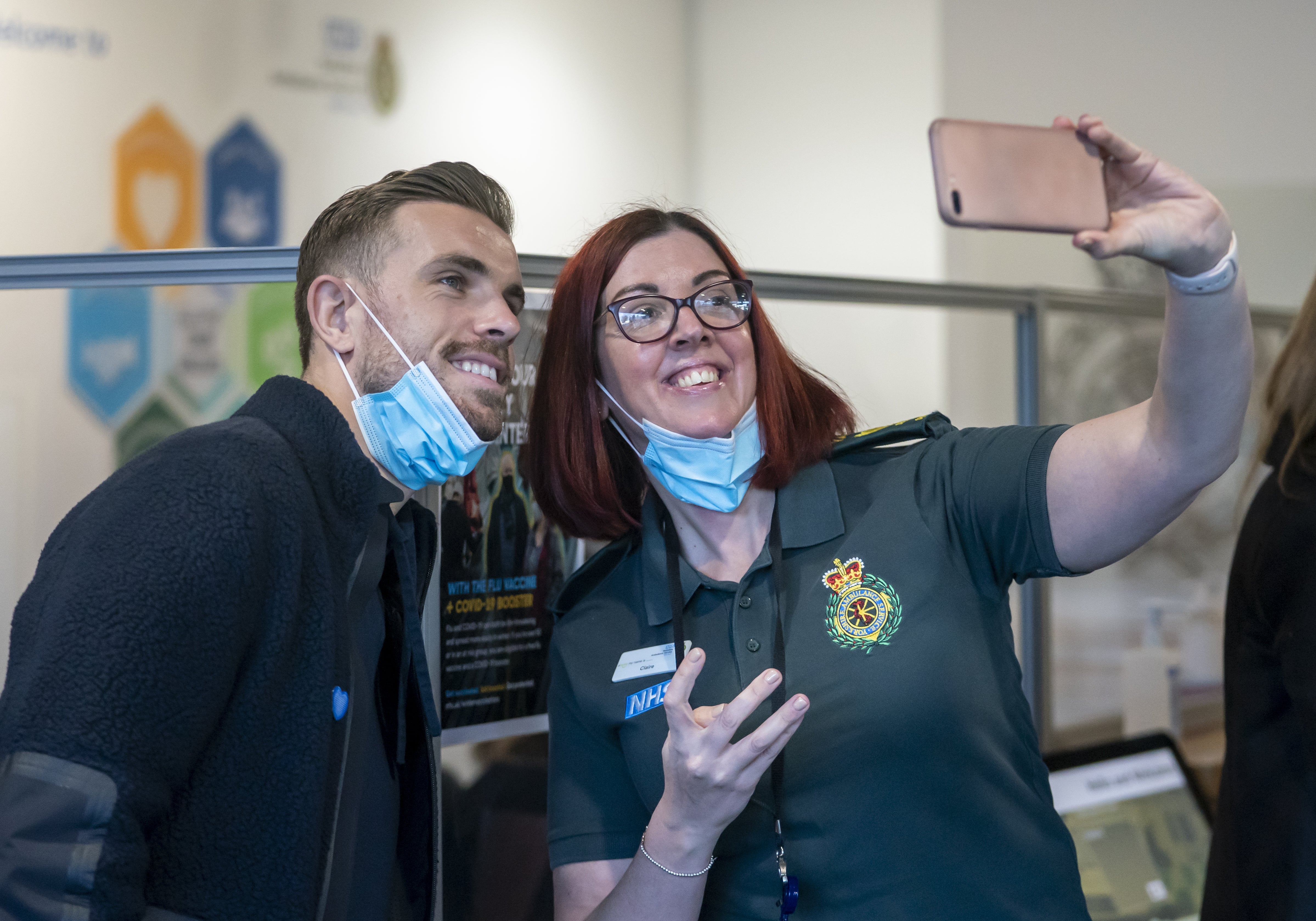 England star and Liverpool captain Jordan Henderson has a selfie taken with Head of Operations Claire Lindsay during a visit to the Yorkshire Ambulance Service in Wakefield (Danny Lawson/PA)