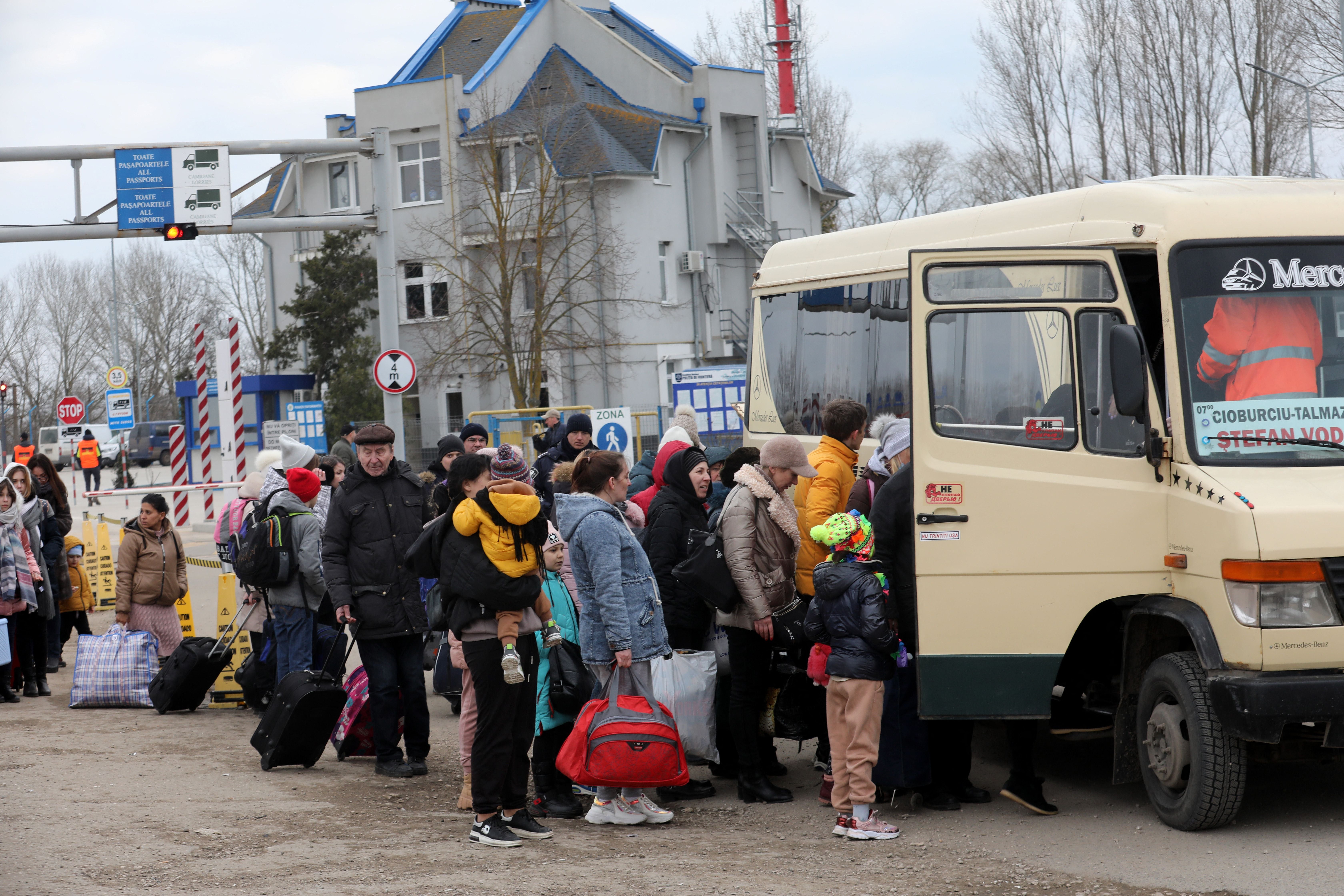 People fleeing Russia’s invasion board a bus near the village of Palanka, Moldova, 14 March 2022