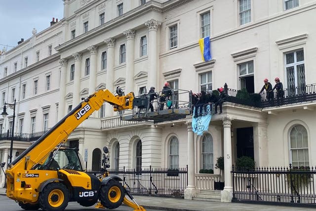 A cherry picker was used by police called to the protest in Belgrave Square on Monday. (Jonathan Brady/PA)