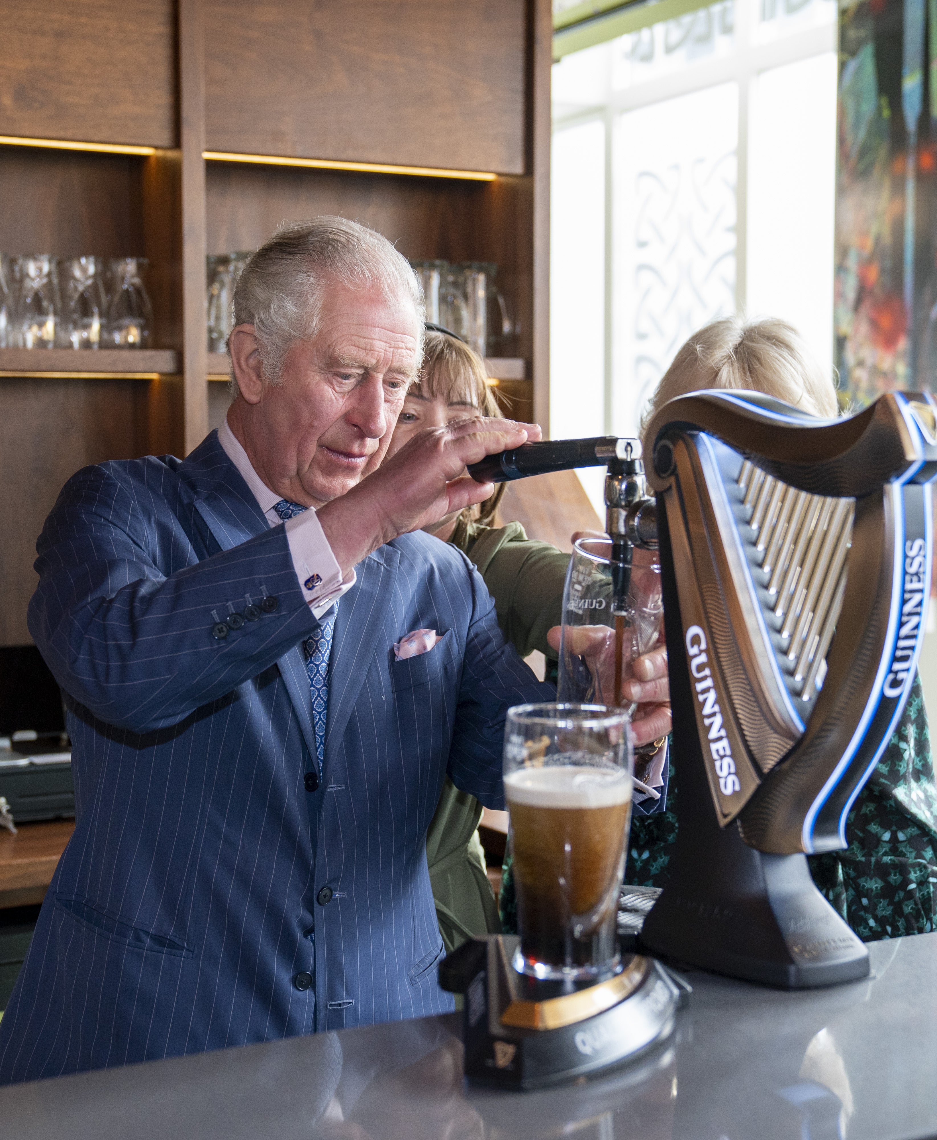 The Prince of Wales pours a pint of Guinness (Arthur Edwards/The Sun/PA)