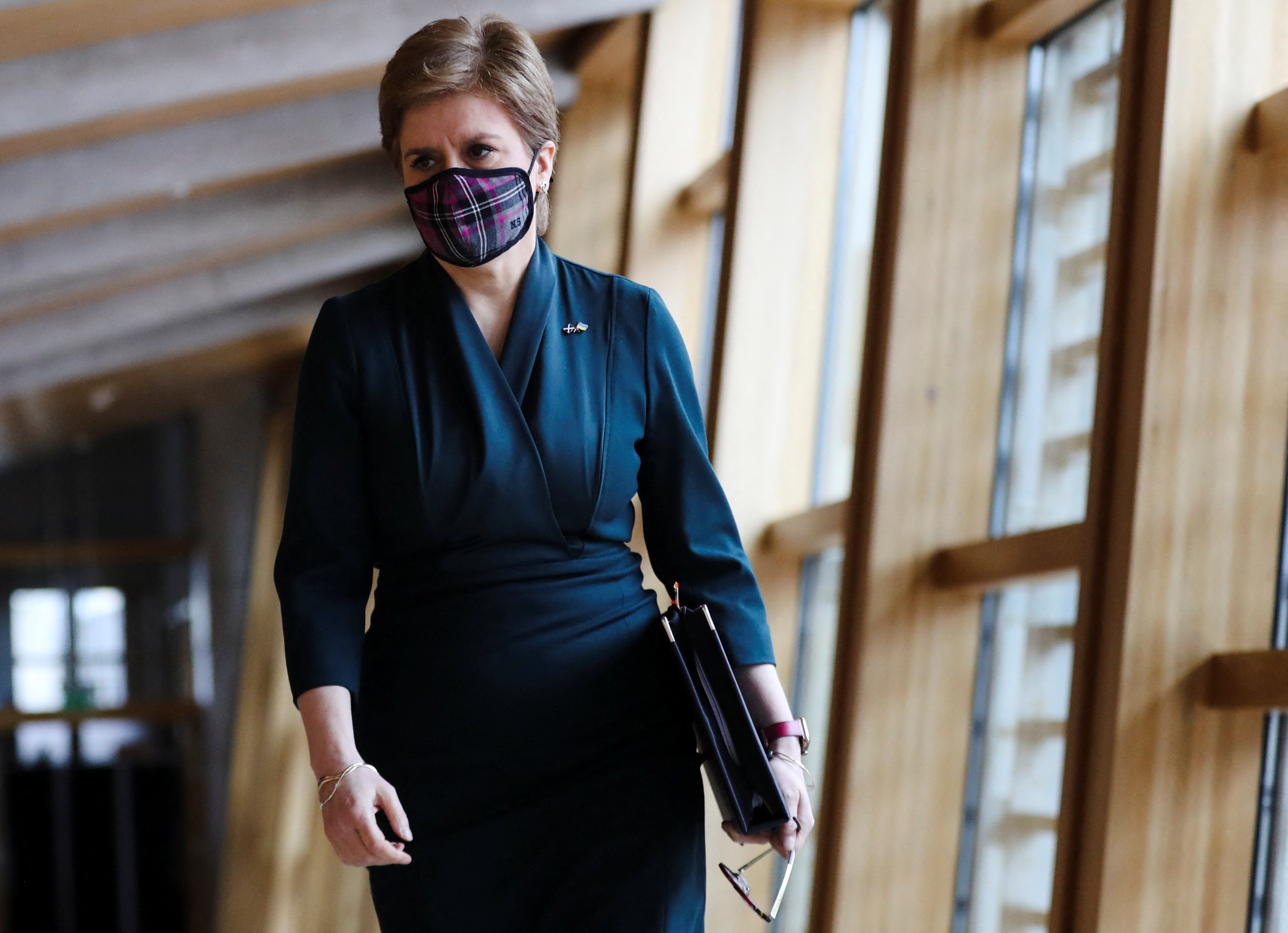 Nicola Sturgeon has delayed the date when Scots will no longer legally be required to wear face masks on public transport and in some other settings (Russell Cheyne/PA)