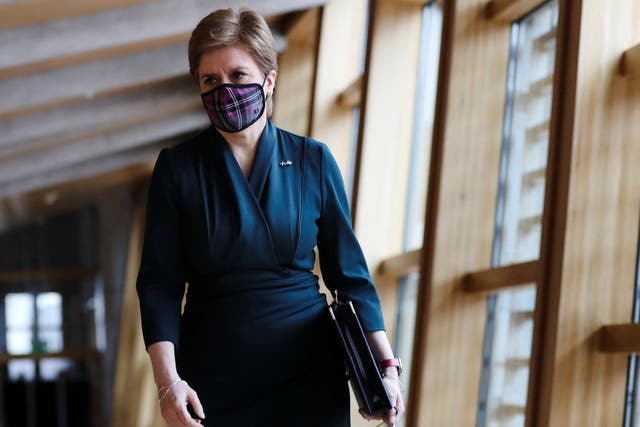 Nicola Sturgeon has delayed the date when Scots will no longer legally be required to wear face masks on public transport and in some other settings (Russell Cheyne/PA)