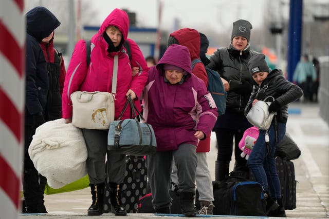 People fleeing the war in Ukraine at the border crossing in Palanca, Moldova (Sergei Grits/AP)