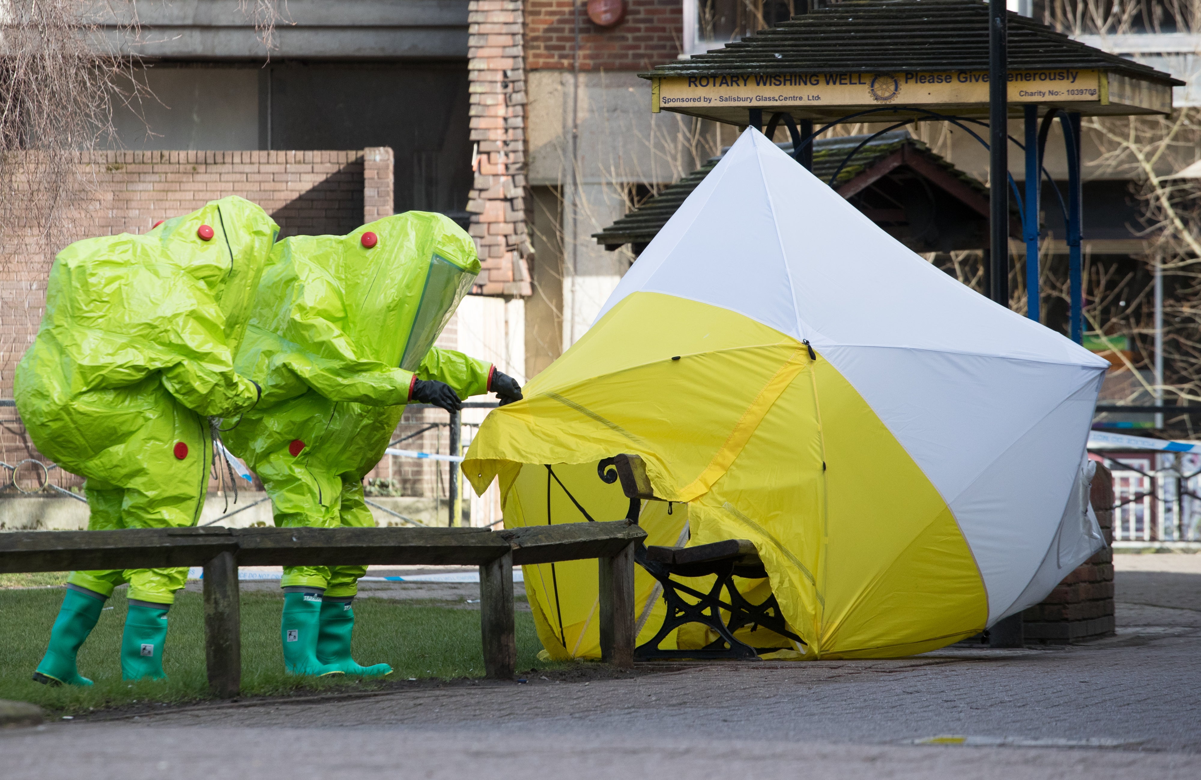 Specialist officers secure the police forensic tent covering the bench where Sergei Skripal was found