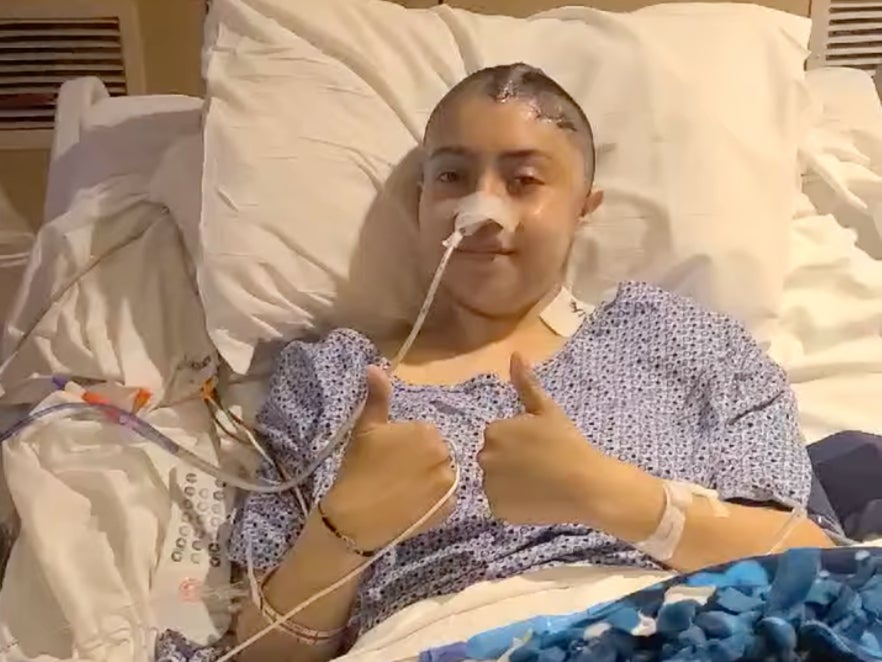 Kemery Ortega, 18, recovering in her hospital bed after she was shot in the head during a drive-by shooting outside her DeMoines, Iowa high school.