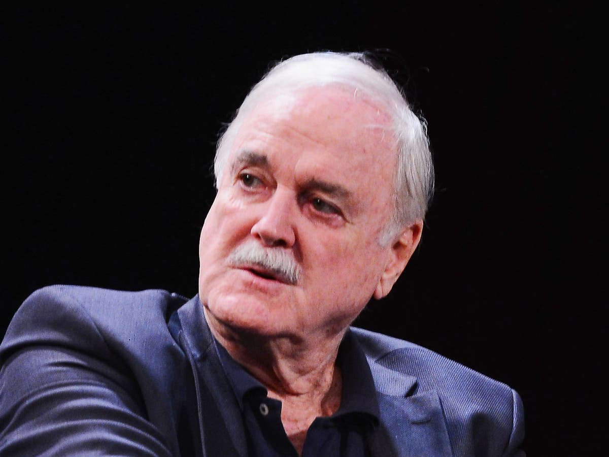 John Cleese responds to claim his mic was taken away over a slavery joke