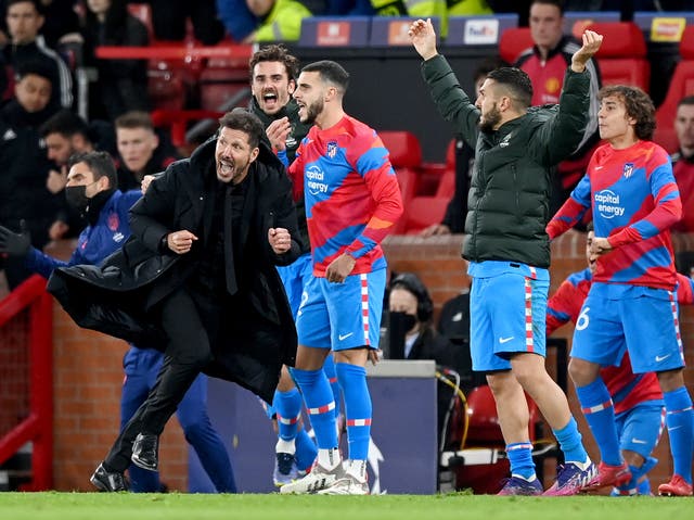 <p>Atletico Madrid manager Diego Simeone runs down the Old Trafford touchline</p>