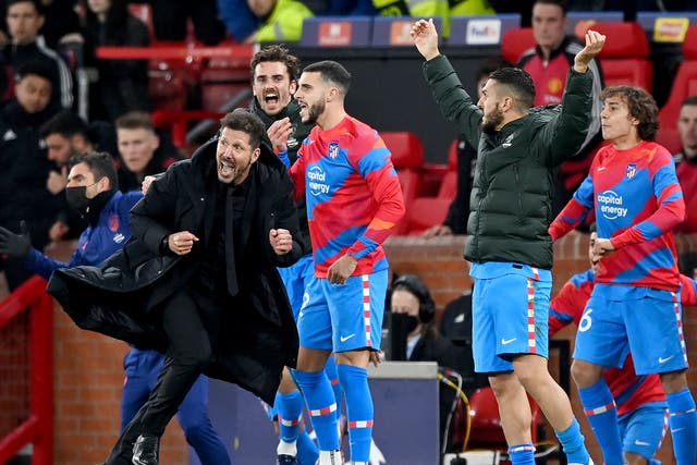 <p>Atletico Madrid manager Diego Simeone runs down the Old Trafford touchline</p>