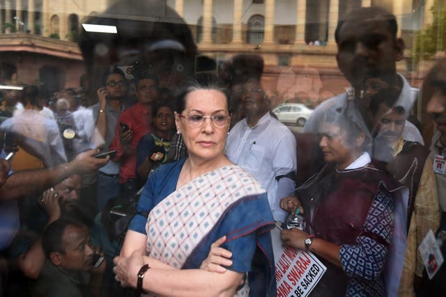 <p>File: Congress President Sonia Gandhi after a protest by Congress Party Members of Parliament at the Mahatma Gandhi statue outside Parliament house in 2015 </p>