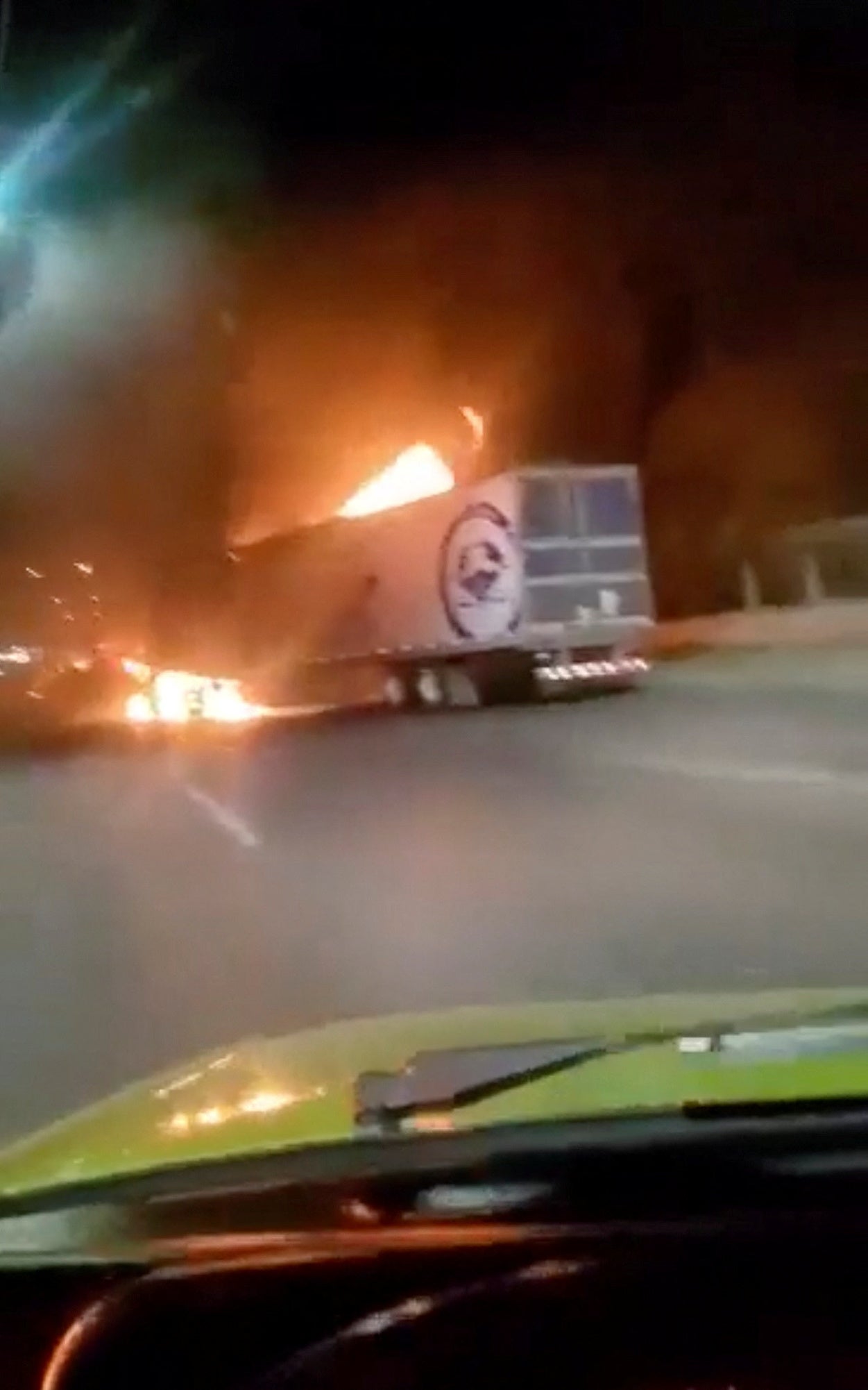 A truck is seen set ablaze in the Mexican border city of Nuevo Laredo following the arrest of the alleged gang leader Juan Gerardo Trevino, also known as, ‘El Huevo’