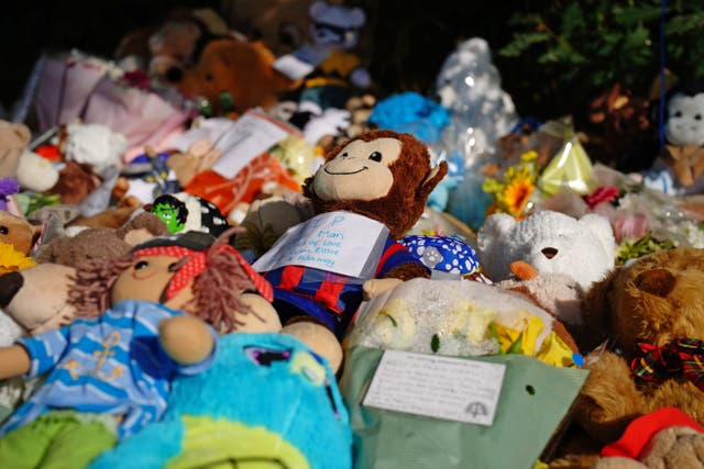 Tributes left at the scene in the Sarn area of Bridgend, south Wales, near to where five-year-old Logan Mwangi was found dead in the Ogmore River (PA)