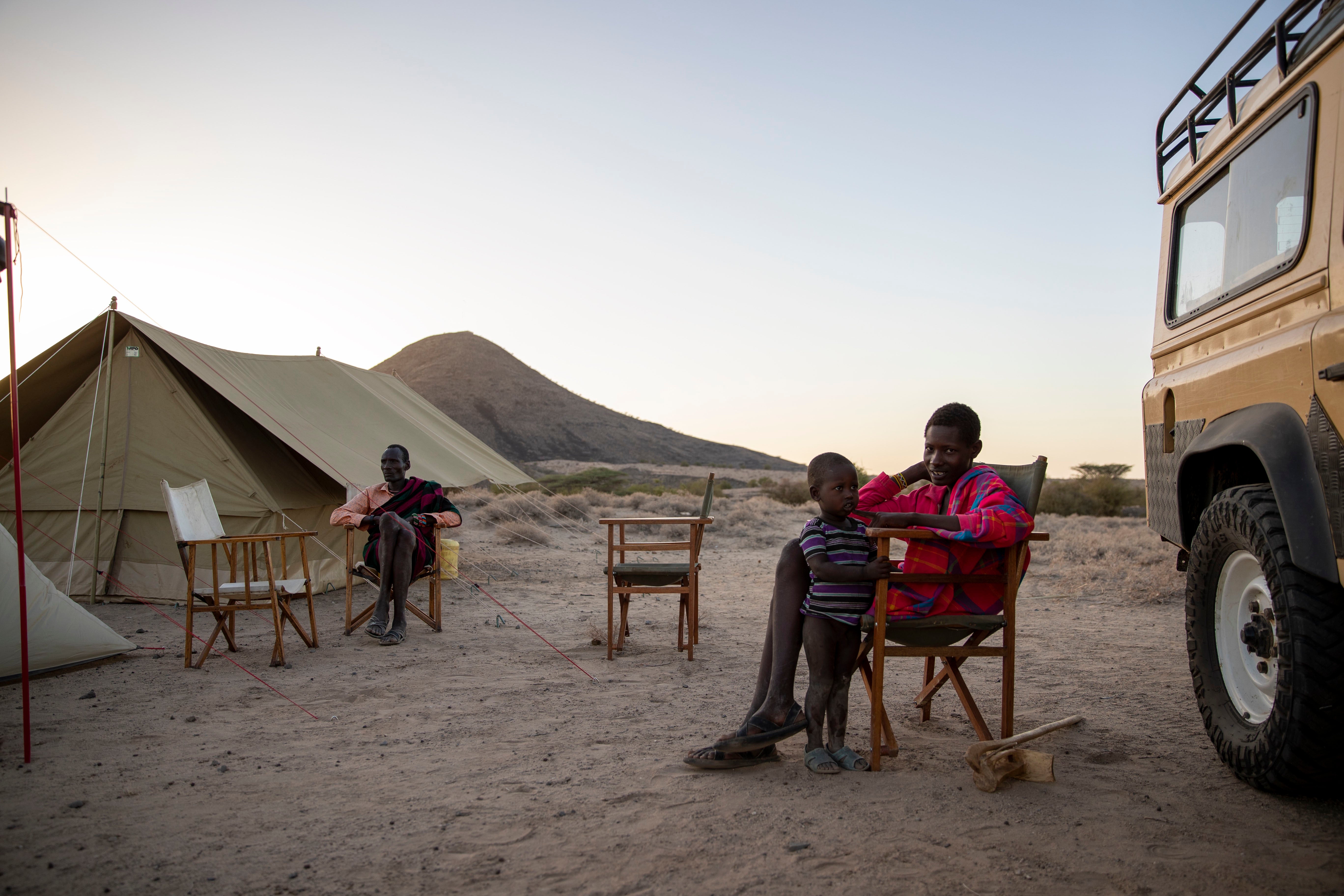 Loura Ekaale with two of his sons, Lolampa and Anam, in the foreground