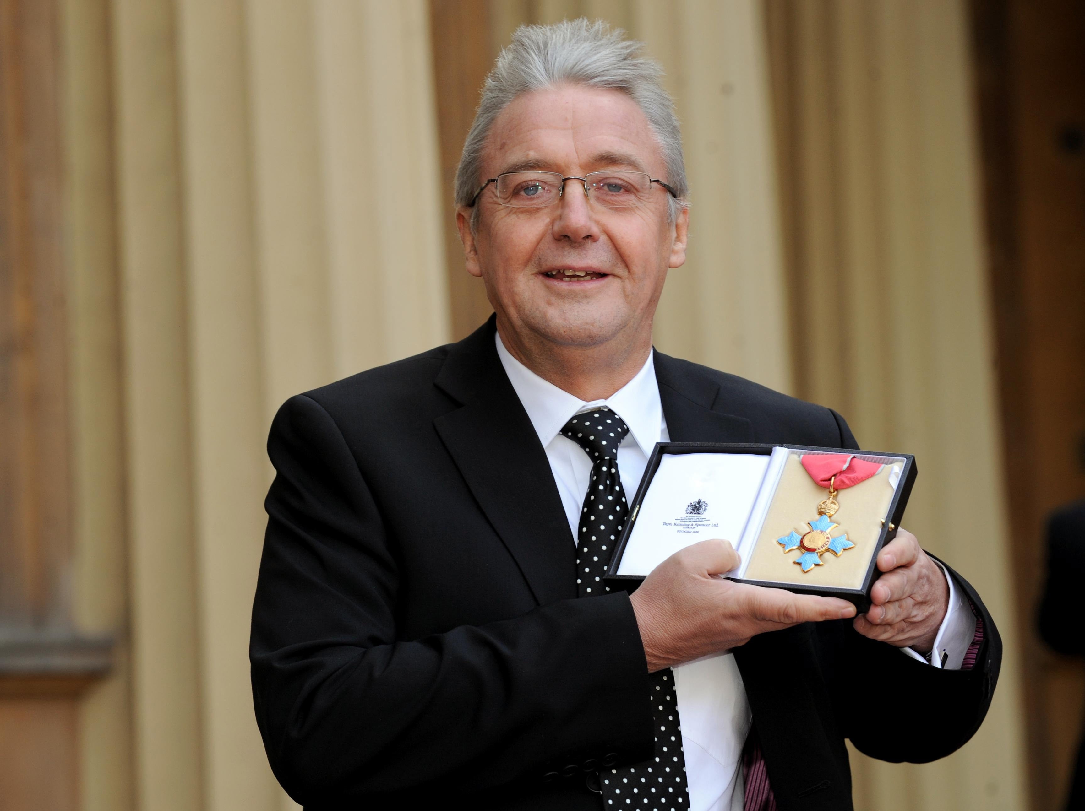 Sir Graham Vick with his CBE in 2009 (Anthony Devlin/PA)