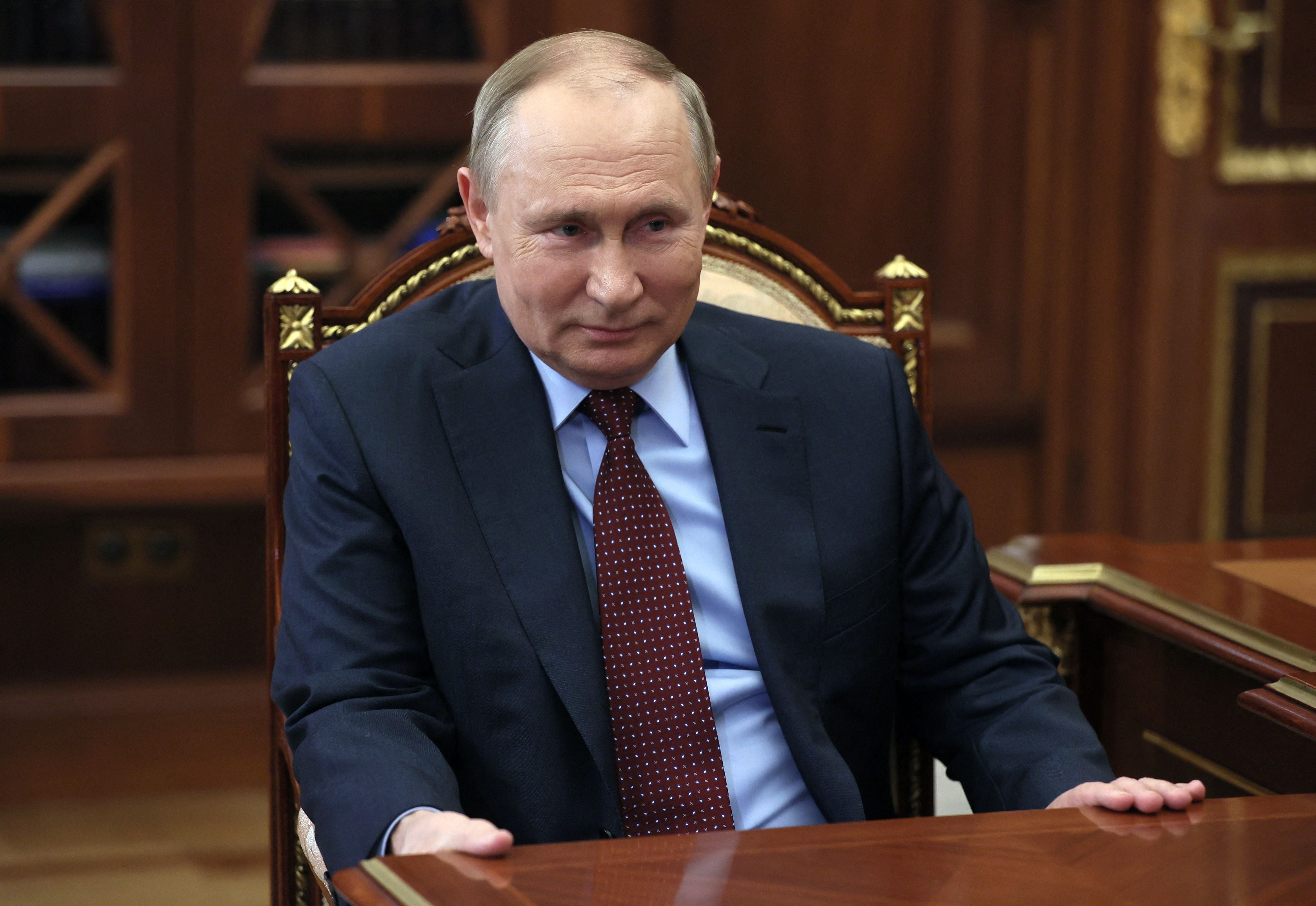 Russian President Vladimir Putin attends a meeting at the Kremlin in Moscow, 2 March 2022