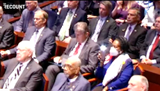 Joe Manchin seen swiping on iPad while Marjorie Taylor Greene looks for phone during Zelensky’s speech