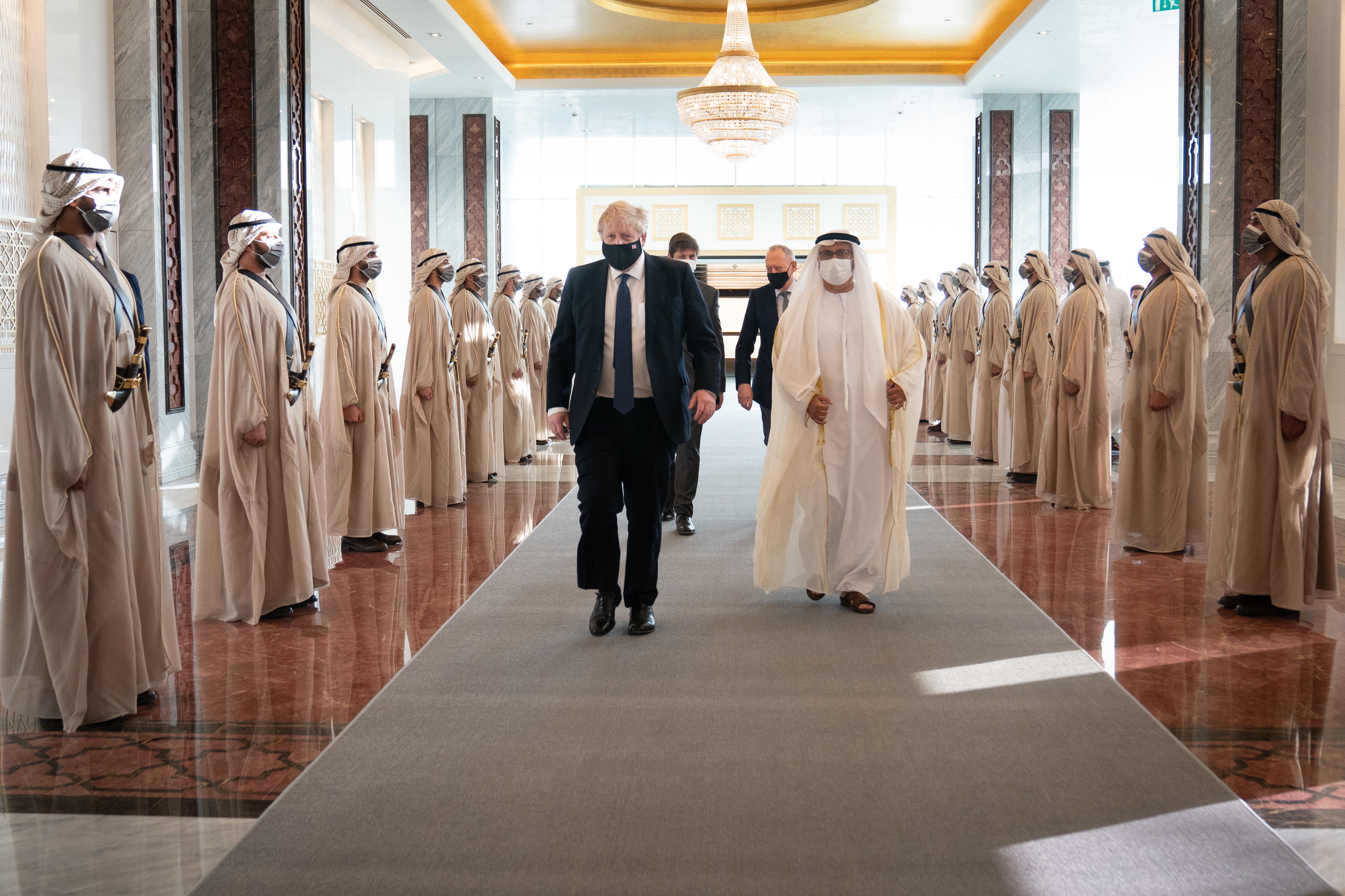 Boris Johnson inspects the Guard of Honour as he arrives at Abu Dhabi airport (Stefan Rousseau/PA)