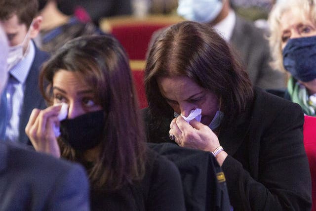 A woman wipes away tears during the BMA memorial service for doctors who have died from Covid (Joshua Bratt/PA)