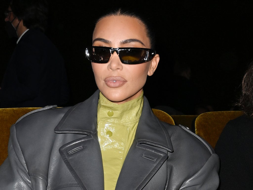 Kim Kardashian says she ‘found happiness’ with Pete Davidson and reveals he has her name branded on his chest